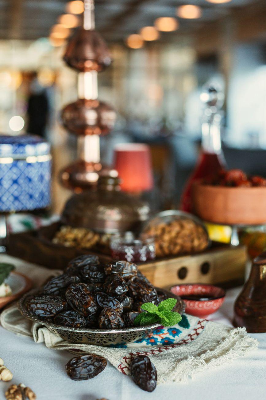 A bowl of dates on a decorated table