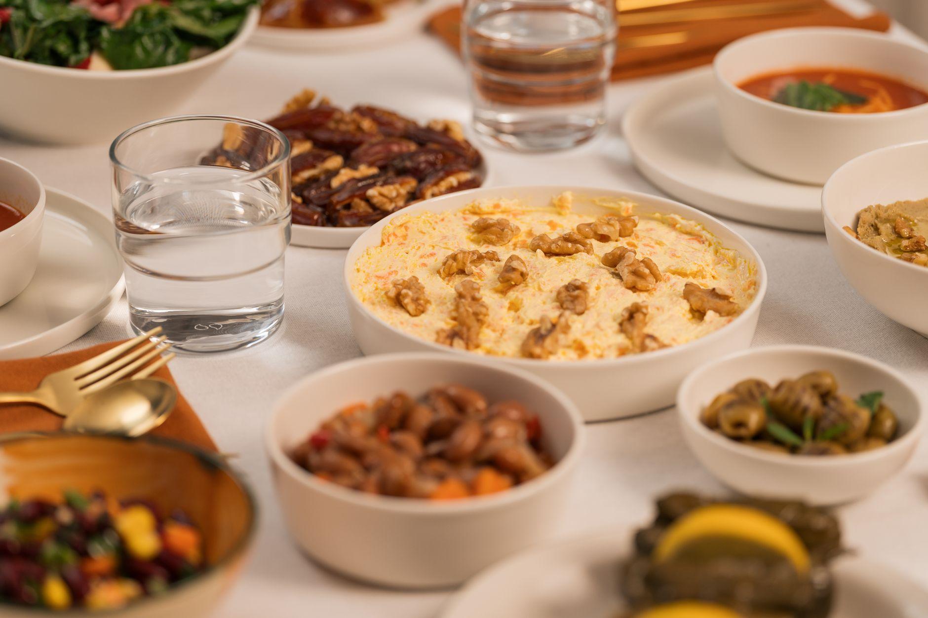 A table set for iftar with dishes for the end of the fasting day